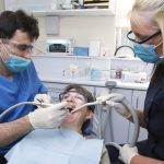 _111652455_c0467269-dentist_and_dental_nurse_carrying_out_dental_treatment