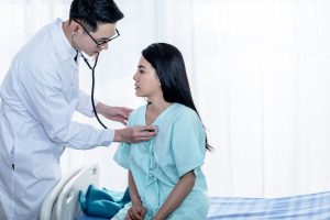 Asian,Male,Doctor,Using,A,Stethoscope,Lisen,To,Heart,Rate