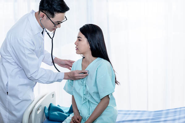 Asian,Male,Doctor,Using,A,Stethoscope,Lisen,To,Heart,Rate